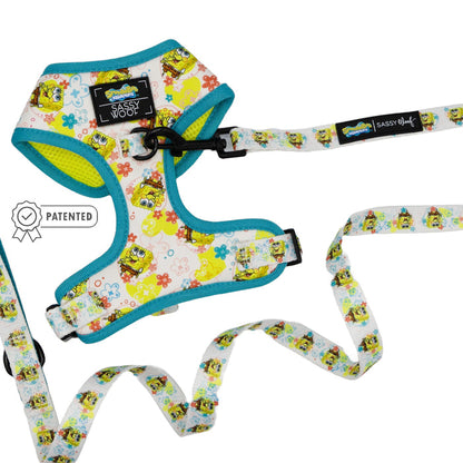 Sassy Woof Dog Two Piece Bundle - SpongeBob SquarePants™ Bikini Bottom: Colorful harness and adjustable leash with playful prints, blue trim, brand tag, and patented Puppy Growth Pawtection Plan symbol on the left.