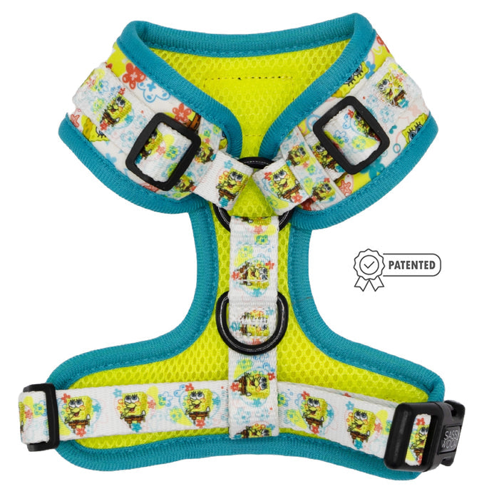 The Sassy Woof Dog Two Piece Bundle - SpongeBob SquarePants™ Bikini Bottom features a colorful harness with teal edges, yellow mesh, and white cartoon-patterned straps. Pair with our adjustable leash for extra Puppy Growth Pawtection Plan benefits!.