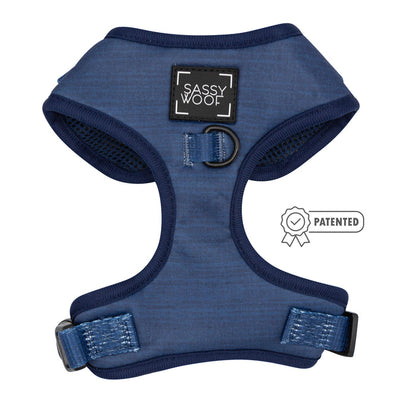 A blue Sassy Woof Dog Two Piece Bundle - Twilight from the Twilight Collection, with dark blue trim and front logo. This adjustable harness has a patented design icon, metal leash ring, and is included in the Puppy Growth Pawtection Plan.