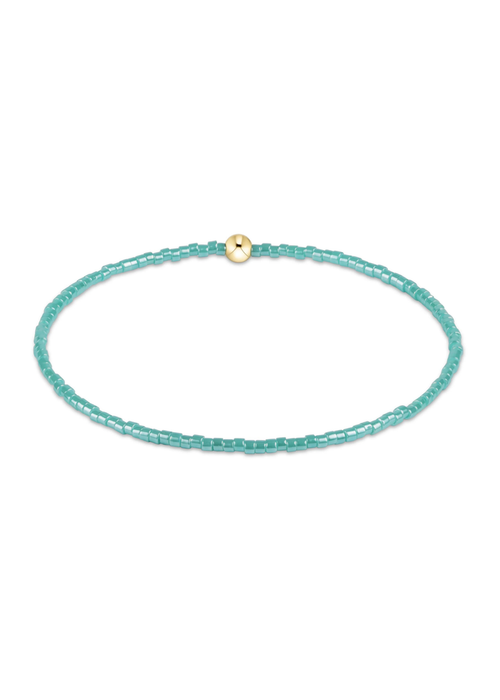 Blue beaded bracelet on a white background