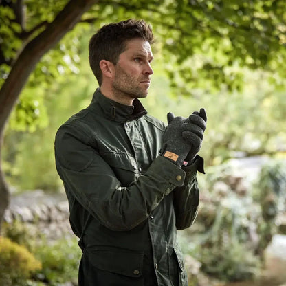 Lifestyle shot of a man outdoors wearing a pair of Extremities Furnace Pro Glove