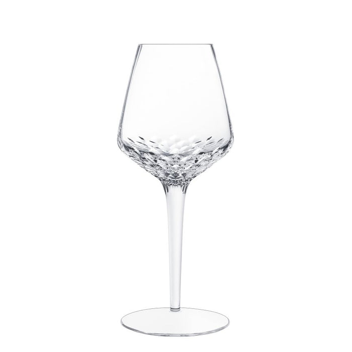 A clear, empty Folia Stemware crystal wine glass by Saint-Louis/Hermès, featuring a tall stem and a textured, patterned bowl that is expertly hand-cut and mouthblown, displayed against a plain white background.