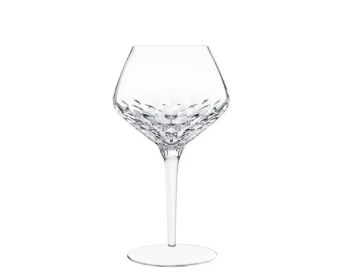 Mouthblown Folia Stemware crystal wine glass with an angled bowl featuring faceted, leaf-like cut patterns and a slender stem.