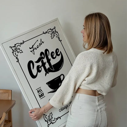 Fresh Coffee Served Here Print held up against a living room wall