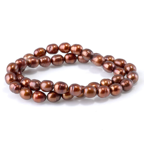 This is a Dakota Stones 7-9mm Freshwater Pearl Golden Brown Potato Gemstone strand of round beads in 15-16 inch strand.
