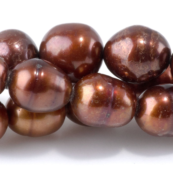 This is a Dakota Stones 7-9mm Freshwater Pearl Golden Brown Potato Gemstone strand of round beads in 15-16 inch strand.