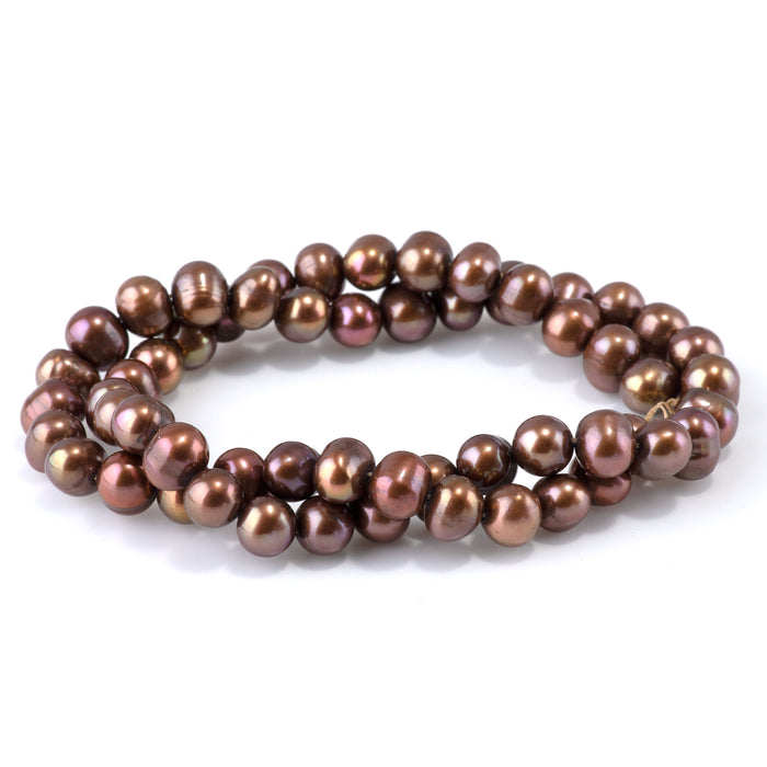 This is a Dakota Stones 7-9mm Freshwater Pearl Light Purple Brown Gemstone strand of round beads in 15-16 inch strand.