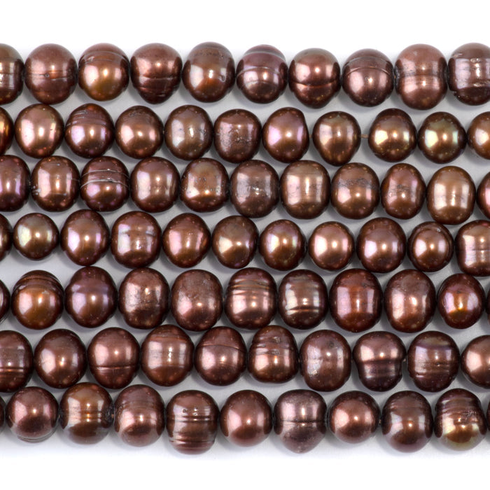 This is a Dakota Stones 7-9mm Freshwater Pearl Light Purple Brown Gemstone strand of round beads in 15-16 inch strand.