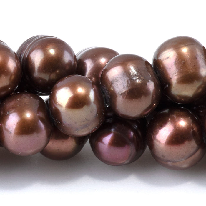 This is a Dakota Stones 7-9mm Freshwater Pearl Light Purple Brown Gemstone strand of round beads in 15-16 inch strand.