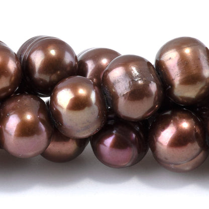 This is a Dakota Stones 7-9mm Freshwater Pearl Light Purple Brown Gemstone strand of round beads in 15-16 inch strand.