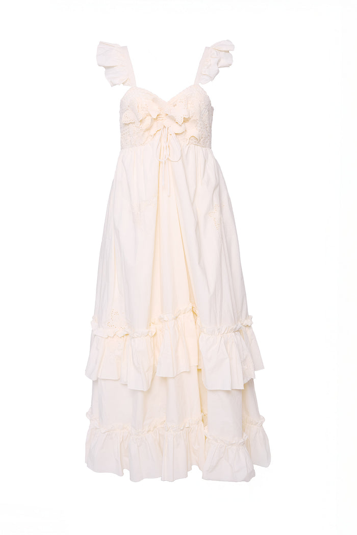 The Gaia Butterfly Dress in Ivory by Ivy City Co is a sleeveless maxi dress featuring ruffled shoulder straps, lace-detailed fitted bodice with bow, and a tiered ruffle skirt. This romantic, airy style is spring-ready and maternity friendly.