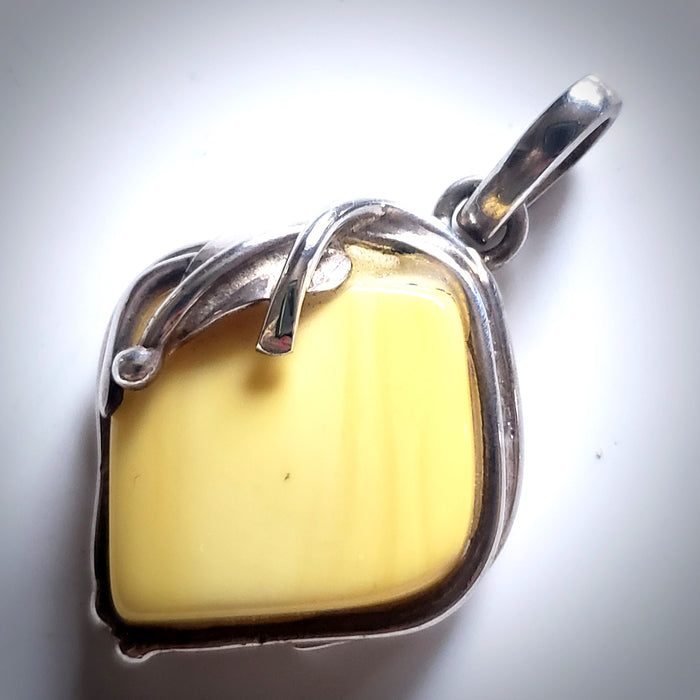 genuine light yellow  butterscotch amber pendant in sterling silver frame