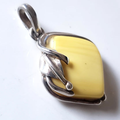 genuine light yellow  butterscotch amber pendant in sterling silver frame
