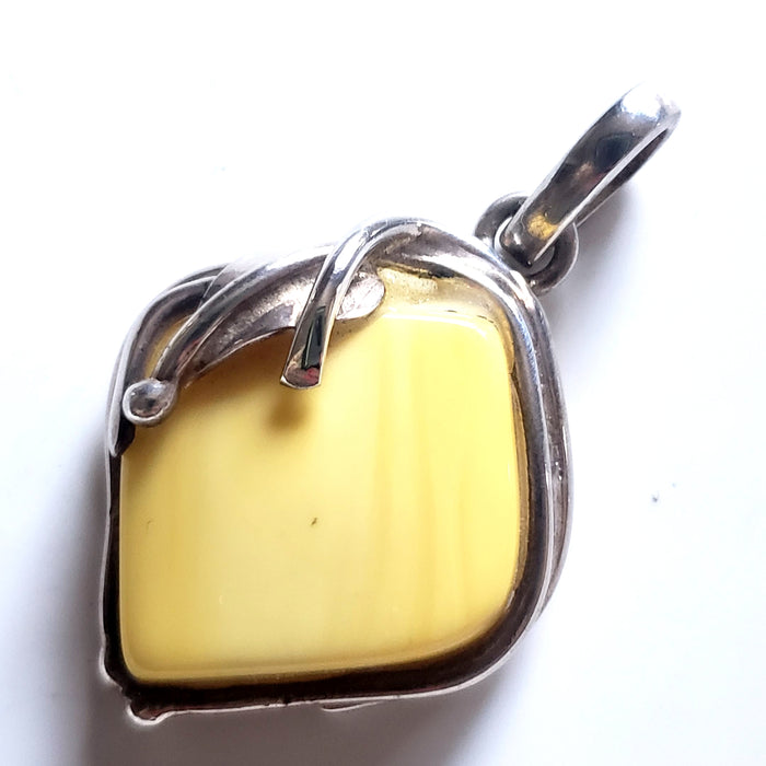 genuine light yellow  butterscotch amber pendant in sterling silver frame