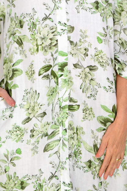 Green floral linen blend tunic by La Mode, showcasing a lightweight, flowy design with a vibrant floral pattern.