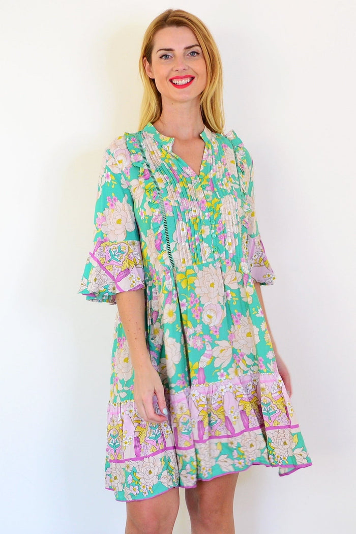 Dream green floral print bohemian tunic dress with flowing fabric and vibrant floral pattern, perfect for casual or boho style wear.