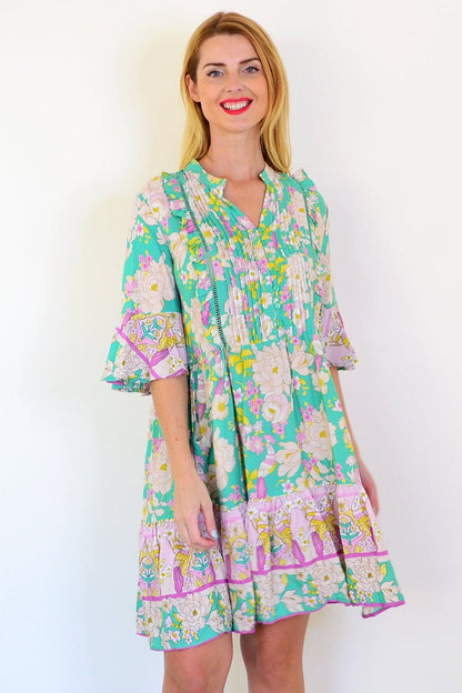 Dream green floral print bohemian tunic dress with flowing fabric and vibrant floral pattern, perfect for casual or boho style wear.