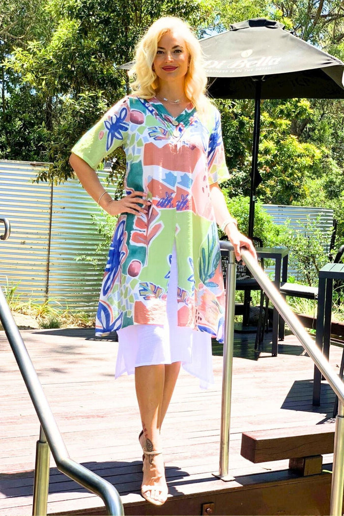 Green floral print summer tunic dress by La Mode featuring a lightweight fabric and a relaxed fit with a V-neck neckline.