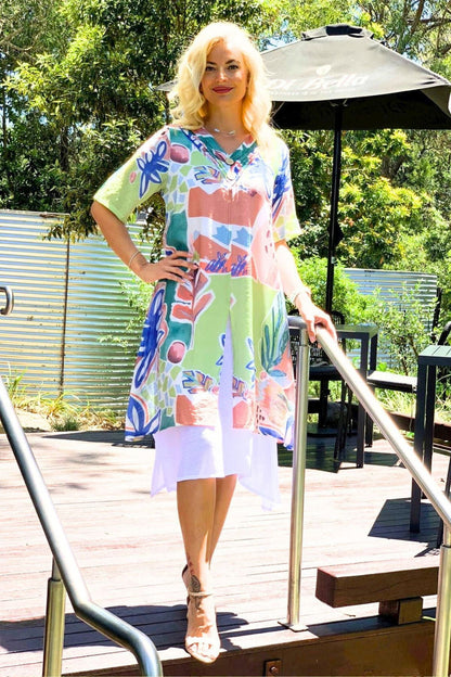 Green floral print summer tunic dress by La Mode featuring a lightweight fabric and a relaxed fit with a V-neck neckline.