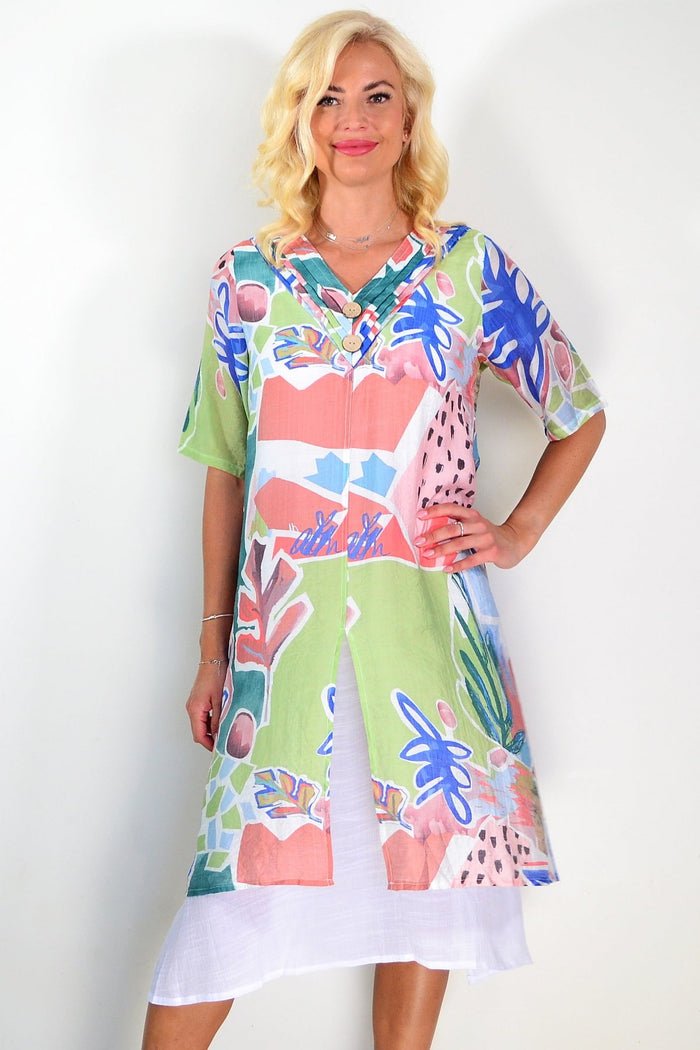 Green floral print summer tunic dress from La Mode, lightweight fabric, flowing fit, with vibrant floral pattern and short sleeves.