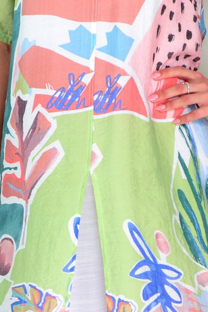 Green floral print summer tunic dress by La Mode, lightweight fabric, with a relaxed fit and vibrant floral pattern.