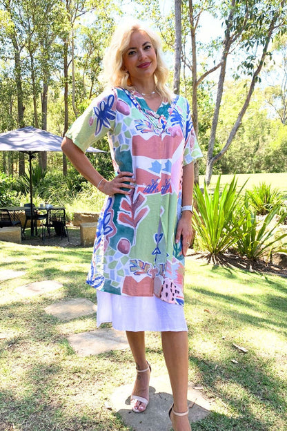 Green floral print summer tunic dress by La Mode, lightweight fabric with vibrant floral pattern, perfect for warm weather.