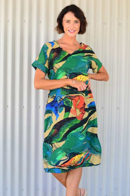 Green and orange playful tunic dress by Hourglass, featuring vibrant color blocks and a relaxed fit, displayed on a mannequin.
