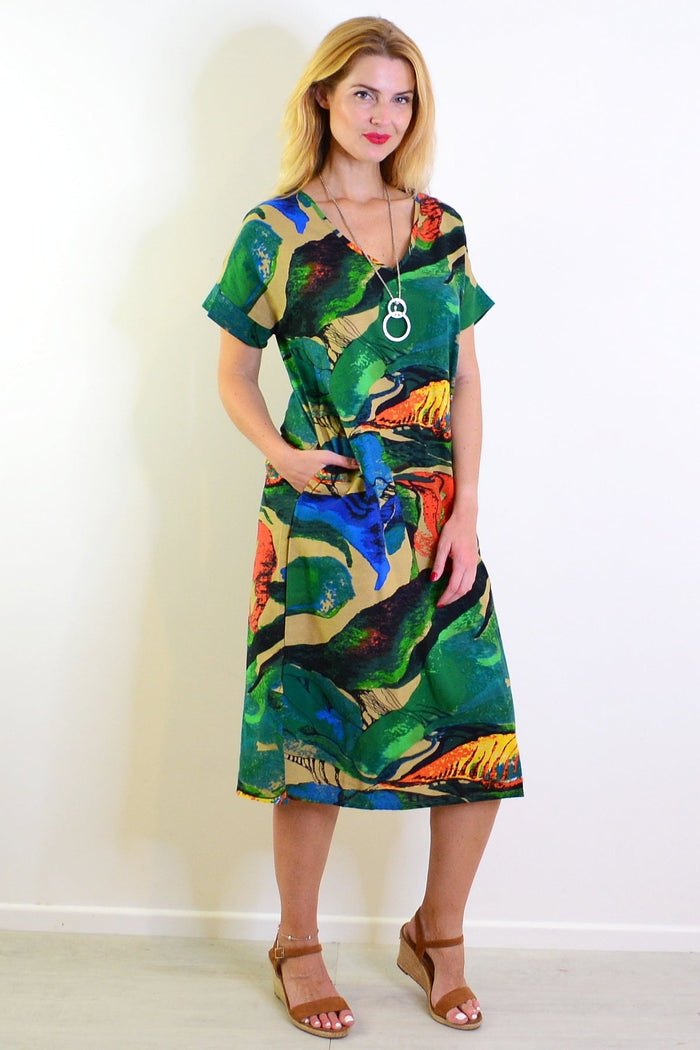Green and orange playful tunic dress by Hourglass, featuring a relaxed fit and vibrant color-block design.