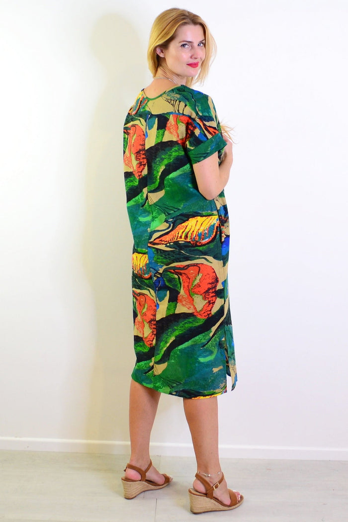 Green and orange playful tunic dress by Hourglass with a relaxed fit, displayed on a mannequin.