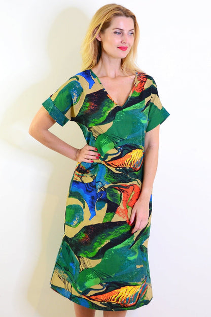 Green and orange playful tunic dress by Hourglass, featuring a relaxed fit and vibrant color-block design.