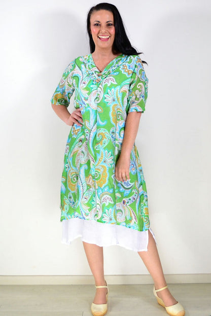 Green paisley summer tunic dress by La Mode, featuring lightweight fabric and boho-style design, displayed on a hanger.