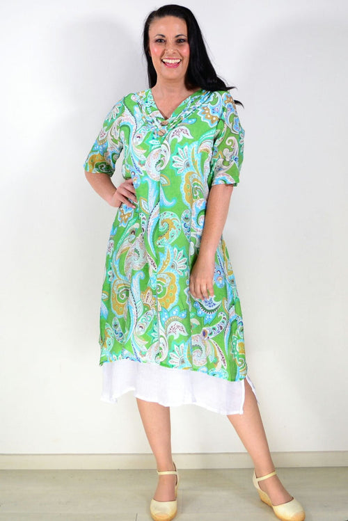 Green paisley summer tunic dress by La Mode, featuring lightweight fabric and boho-style design, displayed on a hanger.