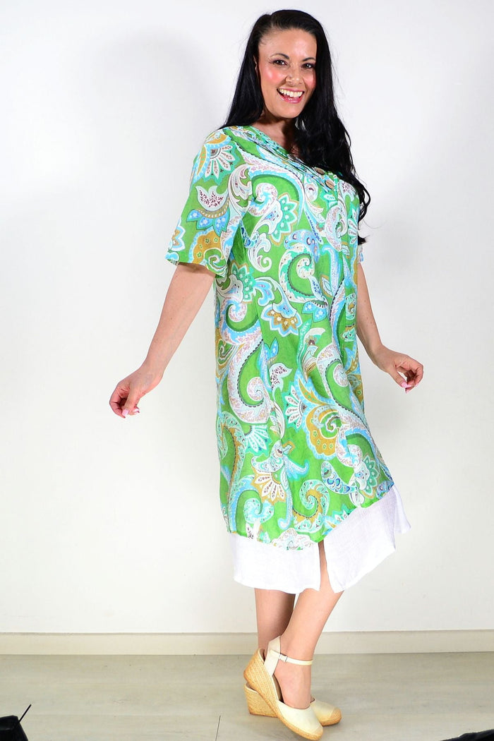 Green paisley summer tunic dress by La Mode, lightweight fabric, flowing design, with floral pattern and short sleeves.