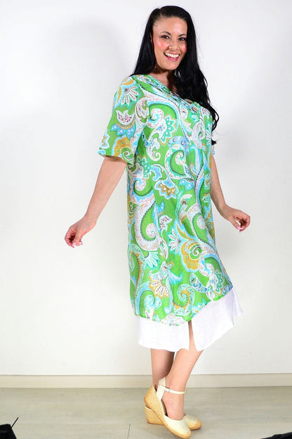 Green paisley summer tunic dress by La Mode, lightweight fabric, flowing design, with floral pattern and short sleeves.