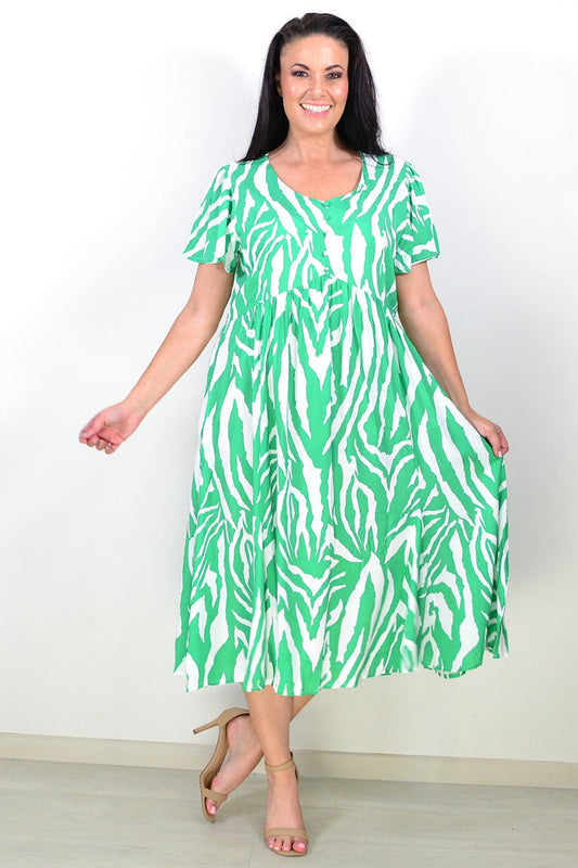 Green and white striped tunic dress by Hourglass, featuring a relaxed fit and casual style, shown on a model.