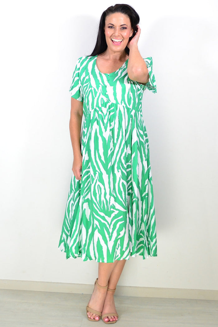Green and white striped tunic dress by Hourglass, featuring a relaxed fit and casual style, displayed on a hanger.
