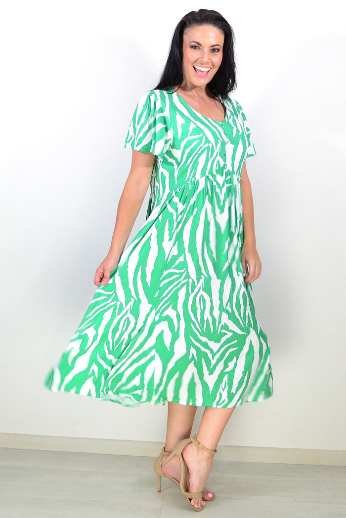Green and white striped tunic dress by Hourglass, featuring a relaxed fit and casual style, displayed on a hanger.
