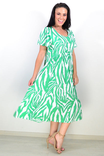 Green and white striped tunic dress by Hourglass, featuring a relaxed fit and casual style, displayed on a hanger.