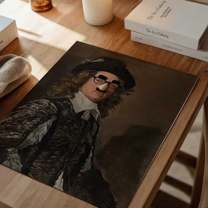 Groucho Disguise Altered Art Print, quirky altered art print unframed on a home office desk