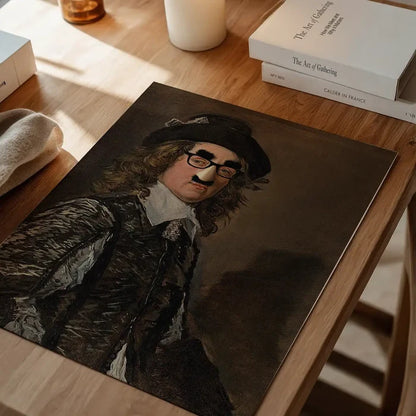 Groucho Disguise Altered Art Print, quirky altered art print unframed on a home office desk