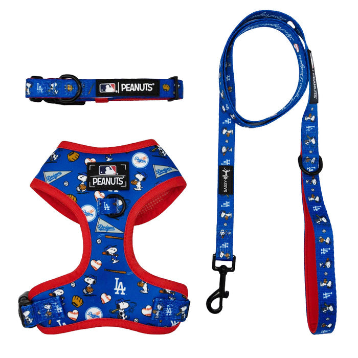 The Sassy Woof Harness Three Piece Bundle - MLB™ x Peanuts™ Los Angeles Dodgers™ features blue and red dog gear with Snoopy, hearts, baseballs, and team logos—ideal for Puppy Growth Pawtection Plan fans. Displayed on white background.