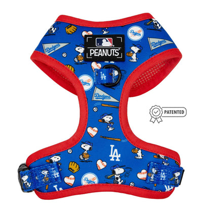 The Sassy Woof Dog Adjustable Harness - MLB™ x Peanuts™ Los Angeles Dodgers™ features Snoopy, baseballs, gloves, hearts, logos, a Peanuts label and a patented badge in blue with red trim.