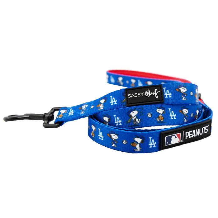 The Sassy Woof Harness Three Piece Bundle - MLB™ x Peanuts™ Los Angeles Dodgers™ features a blue dog leash with Snoopy and Woodstock, team logos, black clasp, and branded patches—pair it with the matching harness and collar for a complete set.