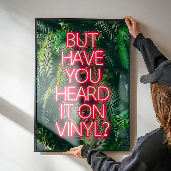 Have You Heard It On Vinyl Centered Poster Print being hung on a wall in a black frame