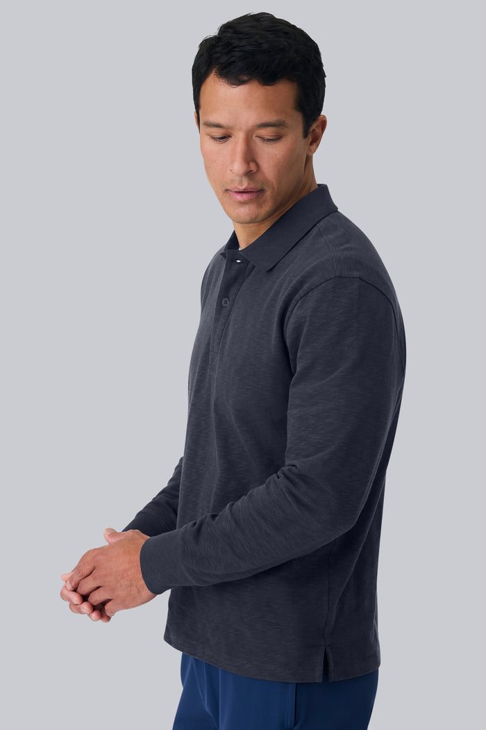 Side view of a man wearing Heavyweight Slub Long Sleeve Polo in Night Sky