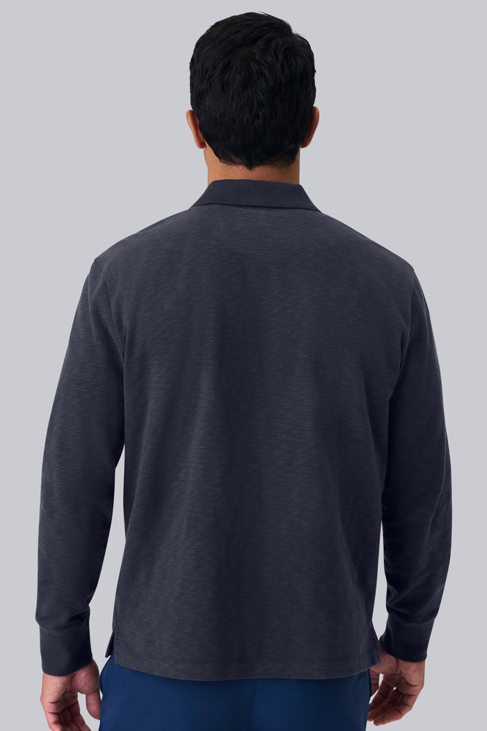 Back view of a man wearing Heavyweight Slub Long Sleeve Polo in Night Sky