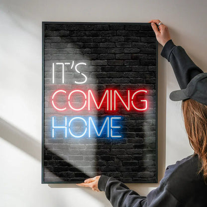 It's Coming Home England Football Poster Print being hung on a wall in a black frame