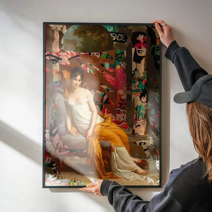 Juliette Recamier Graffiti Portrait print being hung on a wall in a black frame