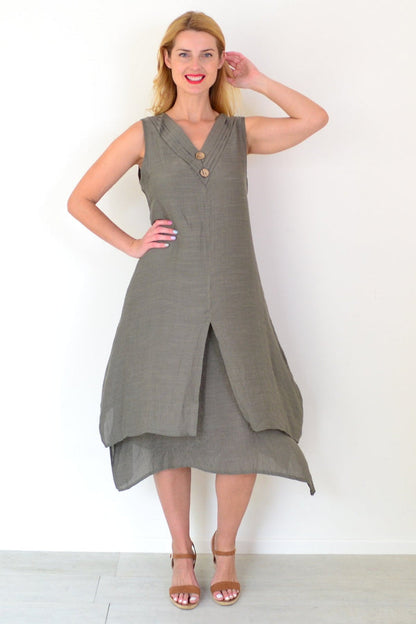 Khaki sleeveless tunic dress with coconut button details by La Mode, shown on a mannequin.