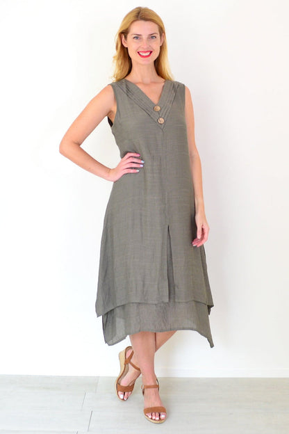 Khaki sleeveless tunic dress with coconut button details, from La Mode, shown on a hanger with a simple background.